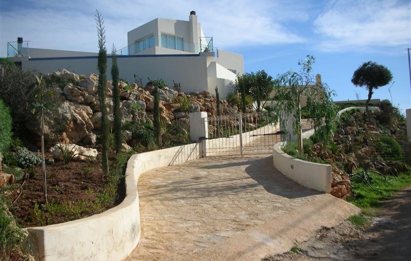 a stone path leading to a house